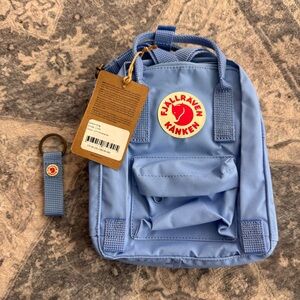 Fjallraven Kanken Mini Backpack in Light Blue with Red Logo